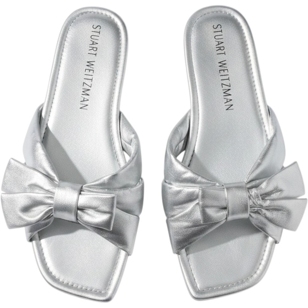 Stuart Weitzman silver Sofia slide sandals featuring a prominent bow design 11.5